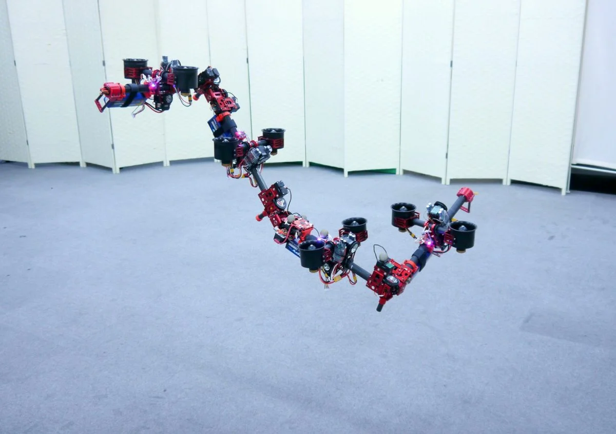 Flying Dragon Robot Transforms Itself to Squeeze Through Gaps