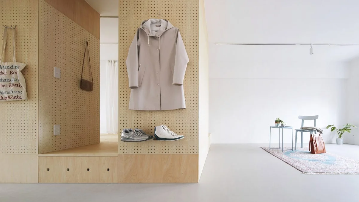 Plywood furniture "islands" are used to customise public housing in Japan