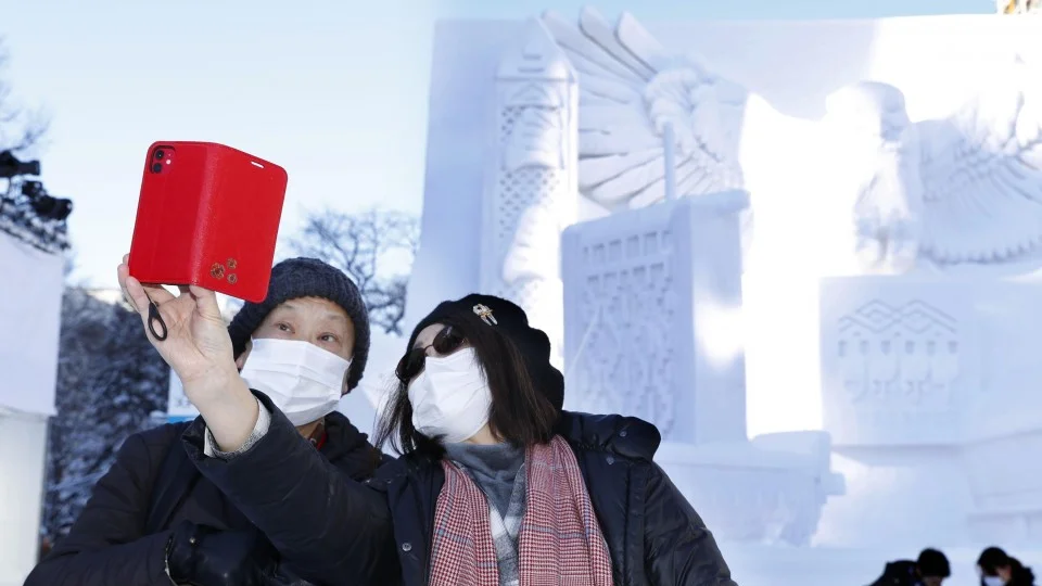 Sapporo Snow Festival opens amid coronavirus fears, warm winter