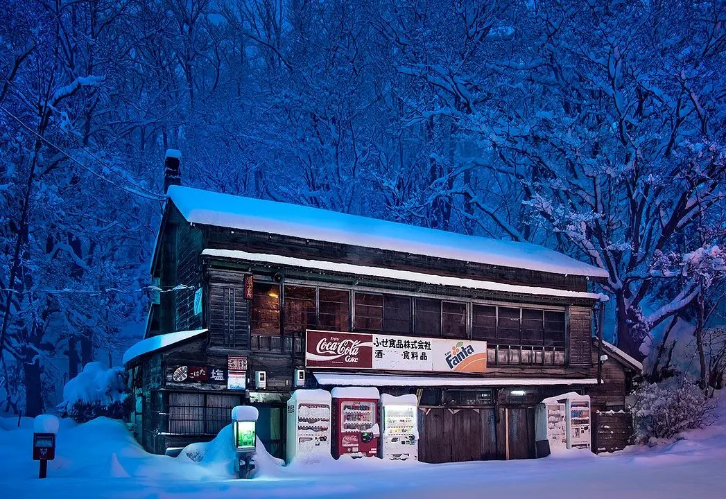 Japanese Vending Machines at Night Juxtaposed with a Wintry Hokkaido Landscape